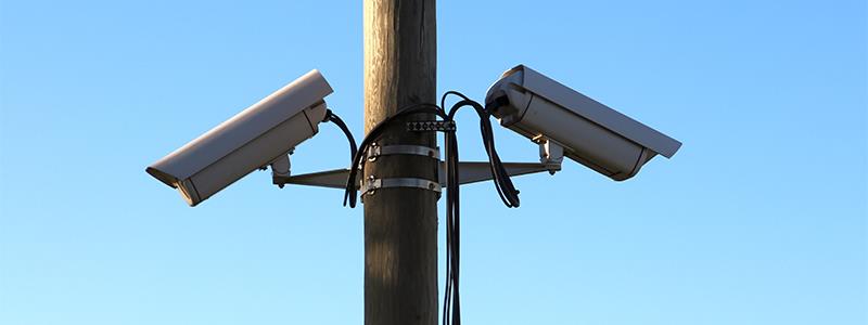 security cameras on a power line pole